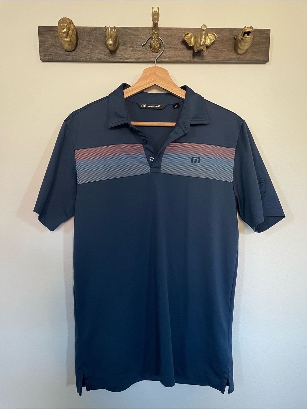 Travis Mathew Navy Polo with Red and Light Blue Stripes